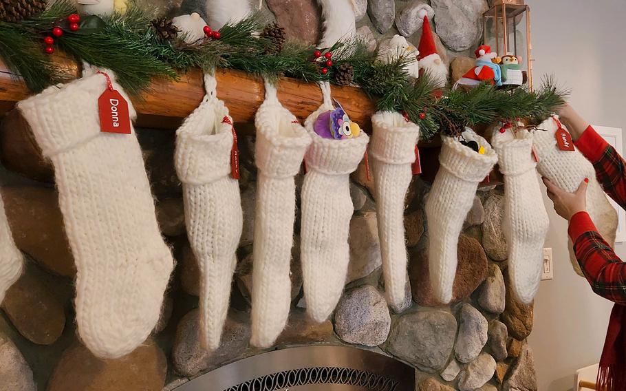 Christmas stockings hung in the living room for each family member